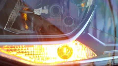 Flashing Car Headlight Bulb - Close-up View Stock Footage 143120486