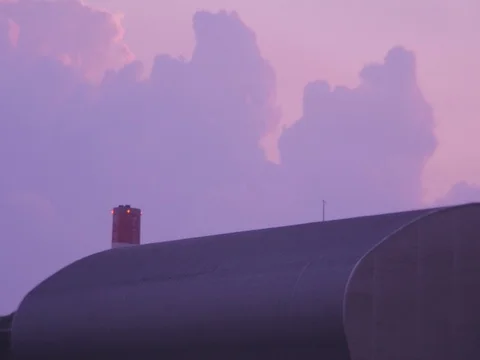 Flashing chimney tower redlights behind evening clouds Stock Footage 73810639