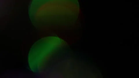 Flashing green light moving vertically in the dark Stockbeeldmateriaal 309892848