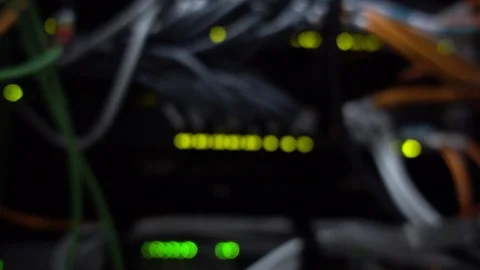 Flashing green lights in a server rack 3 rows. Blurred background. Stock Footage 125228220