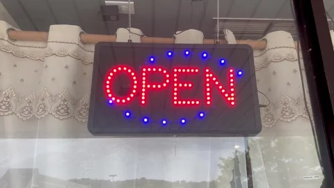 Flashing LED Open Sign In Storefront Window Stock Footage 345095646