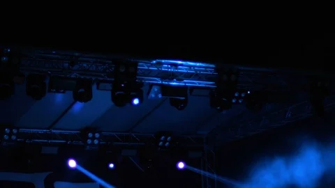 Flashing light beams from stage lights on a construction Stock Footage 92531934