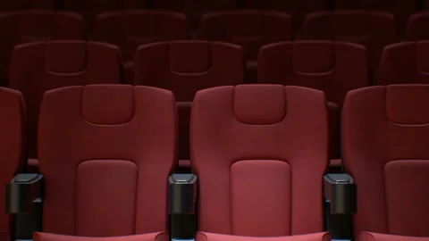 Flashing Light from the Cinema Screen on the Red Chairs in Cinema Hall Seamless Stock Footage 112338070