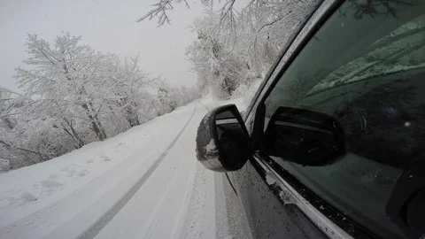 Flashing light on a rear view mirror of a broken car on a snowy road Stock Footage 82363530
