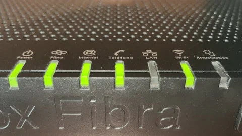 Flashing lights indicating the different connections of a fiber optic router Stock Footage 155862422