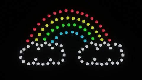 Flashing Neon Dot Rainbow with Clouds on Black Stock Footage 311475283