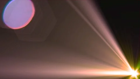 Flashing rays of light at the lower right side of the screen on a dark back.. Stock Footage 253186859
