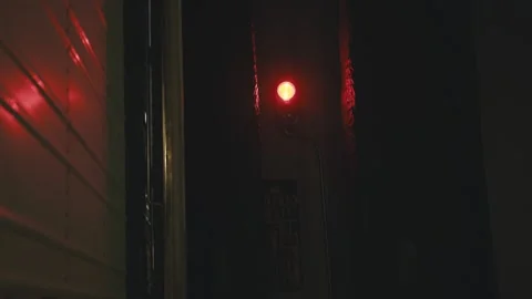 Flashing red emergency light on a loading dock at night Stock-Footage 346970029