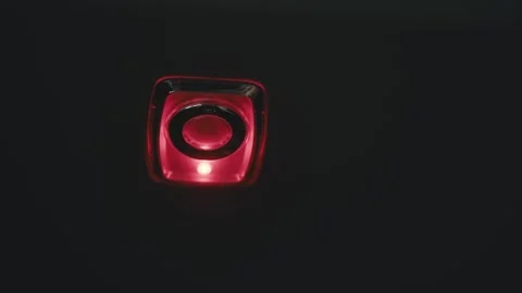 Flashing red power button on black background Stock Footage 348087941