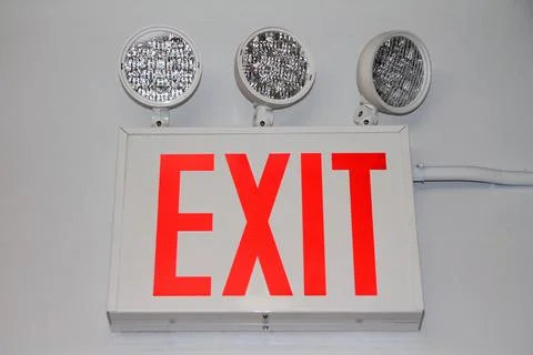 The flashing red security exit sign with three powerful lights Stock Photos