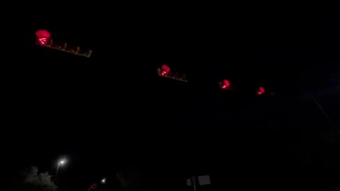Flashing red stop lights at night in Austin, Texas on 9-28-2025 Stock Footage 317937795