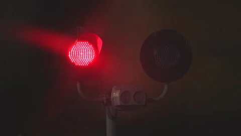 Flashing red traffic light at a railway crossing at night Stock Footage 99743913