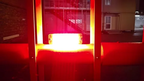 Flashing red warning light on security barrier gate at night. Stock Footage 300299535