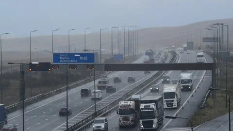 Flashing reduce speed warning lights on M62 motorway uk Stock Footage 141752890
