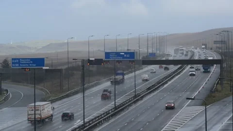 Flashing reduce speed warning lights on M62 motorway uk Stock Footage 141752892
