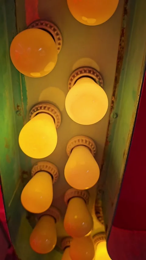 Flashing row of carnival lightbulbs vertical video Stock Footage 333406186