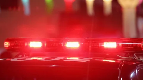 Flashing sirens of police car in downtown Stock Footage