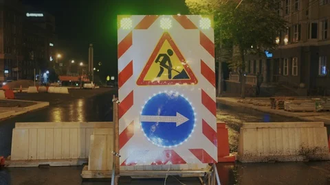 Flashing warning lights at road repairs. Signs to detour. Entrance or road is Stock Footage 120692506