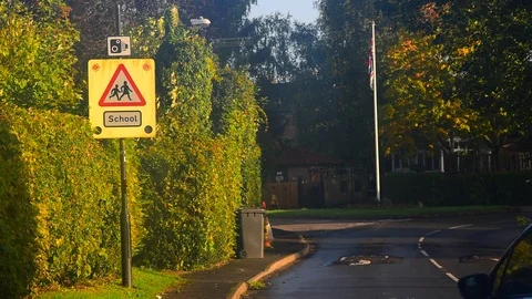 Flashing warning sign for drivers of school ahead united kingdom Stock Footage 117473379