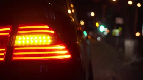 Flashing yellow blinker light on back lamp on the car at night. Led headlights 動画素材 194113011