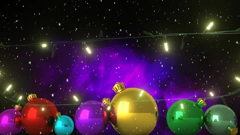 Flashing yellow christmas string lights and coloured baubles, falling snow and Stock Footage 310924780
