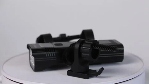 Flashlight and attaching it to the bike. Rotate on the subject table. Shot cl Stock Footage 216949036