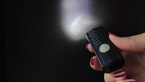 Flashlight and a beam of light in the dark. Flashlight ray in the darkness Stock Footage 318131502