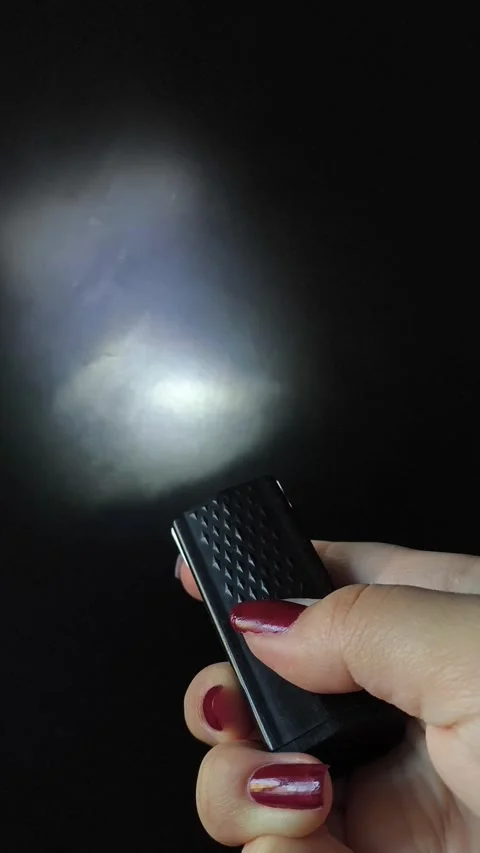 Flashlight and a beam of light in the dark. Flashlight ray in the darkness Stock Footage 318131668