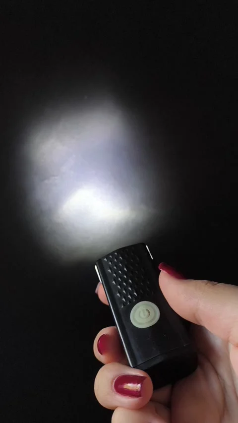 Flashlight and a beam of light in the dark. Flashlight ray in the darkness Stock Footage 318131707