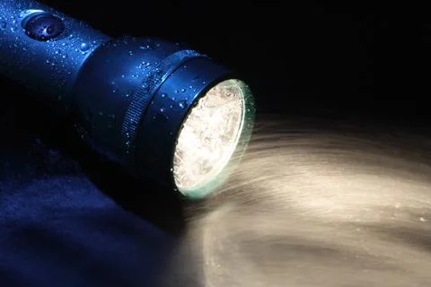 Flashlight and water Stock Photos