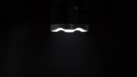 Flashlight Beam Illuminates Swirling Dust Particles In Darkness Stock Footage 327556514