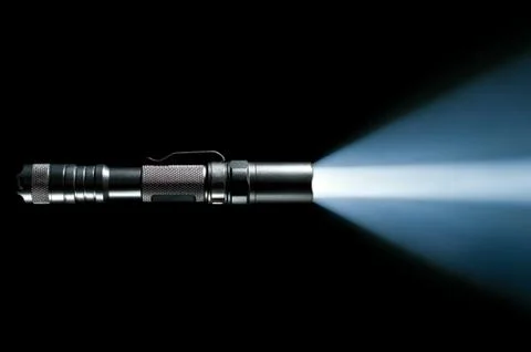 Flashlight with beam of light Stock Photos