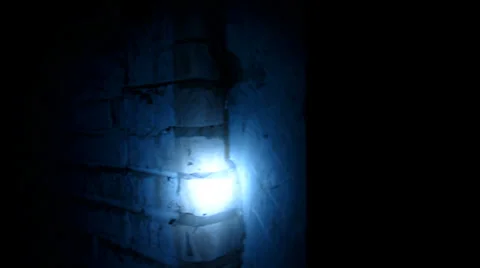 Flashlight beam slips dilapidated brick wall Vídeo Stock 35799248
