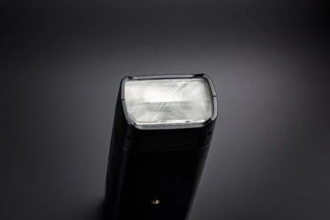 Flashlight on a black background Stock Photos