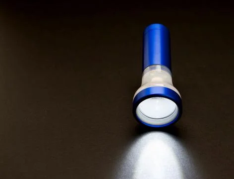 Flashlight in the dark Stock Photos