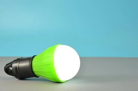 Flashlight in the form of a light bulb. Stock Photos