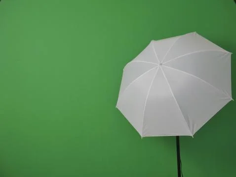 A flashlight on a green background Stock Photos