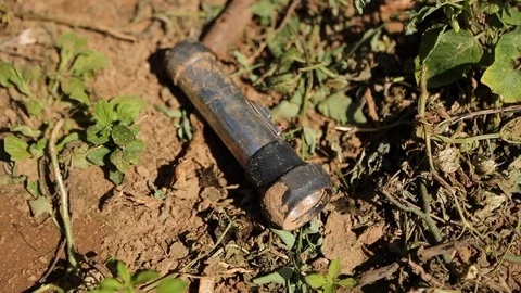 Flashlight on ground Stock Footage 95496522