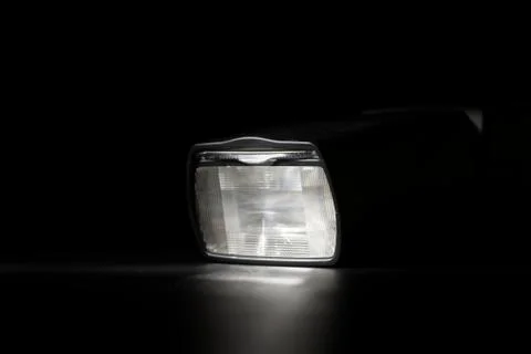Flashlight head on black background in low key light Stock Photos