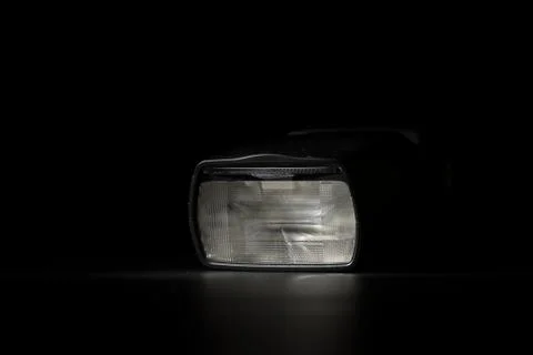 Flashlight head on black background in low key light Stock Photos