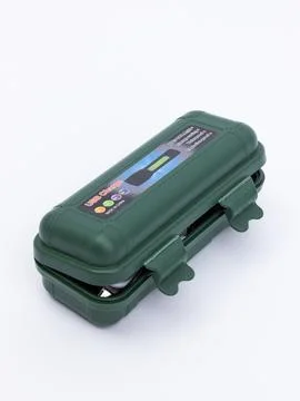 Flashlight kit in green protective case Stock Photos