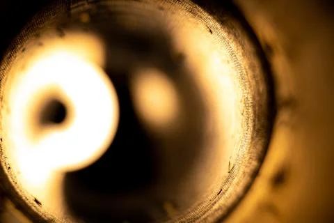 Flashlight light in an empty used anti-tank grenade launcher as a backgroun.. Stock Photos