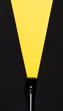 Flashlight with luminous beam made of paper, top view. Search concept Stock Photos