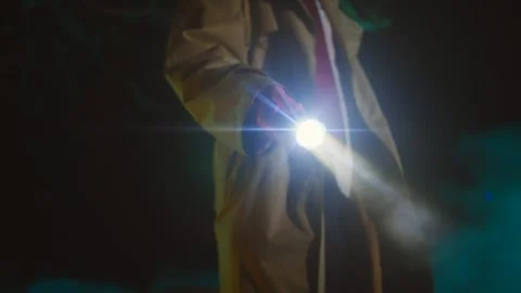 Flashlight at night in the hands of a detective or a policeman police Stock Footage 244705148