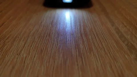 Flashlight on the phone. LED flashlight on a smartphone. Stock Footage 119431741