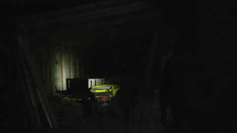Flashlight Searchingly Moves Throughout an Empty Barn Video stock 208733965