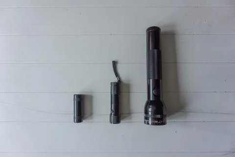 Flashlights arranged on size on white background Foto stock