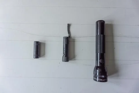 Flashlights arranged on size on white background Stock Photos