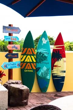 Flashy pattern surfboard and road sing. Stock Photos