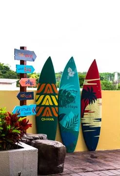 Flashy pattern surfboard and road sing. Stock Photos